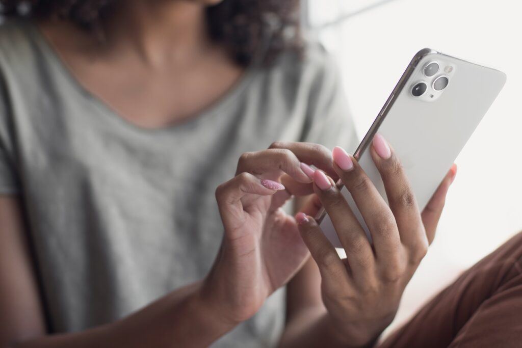 woman using iPhone, iPhone data leak